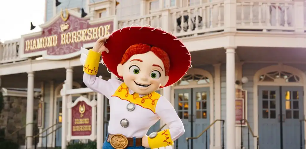 Jessie from Toy Story tipping her hat outside The Diamond Horseshoe at Magic Kingdom Park