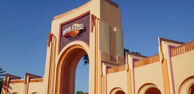 Iconic entrance arch of Universal Studios Florida at Universal Orlando Resort, welcoming guests to a world of thrilling attractions and entertainment.