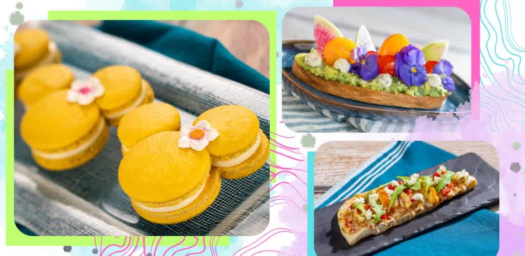 Colorful assortment of desserts including yellow sandwich cookies with flowers, a fruit tart with edible flowers, and a savory flatbread with vegetables and herbs