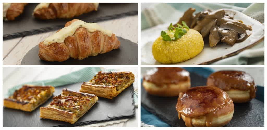Assorted breakfast pastries including croissants with cream cheese, potato croquette, three-piece pizza slices, and caramel-glazed cinnamon rolls on black and slate platters.
