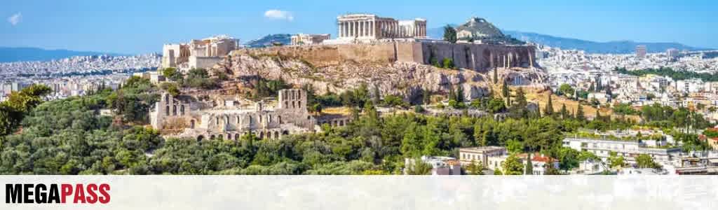 A panoramic view of ancient ruins and the Acropolis in Athens with modern buildings in the background under a clear blue sky