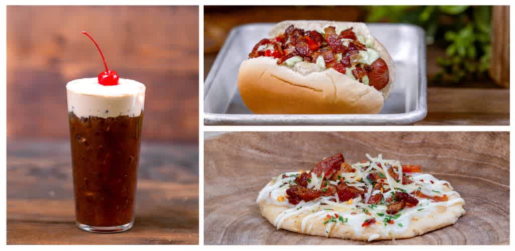 A cold soda with whipped cream and a cherry, a hot dog with chili and toppings on a tray, and a pizza with bacon and cheese on a wooden surface.
