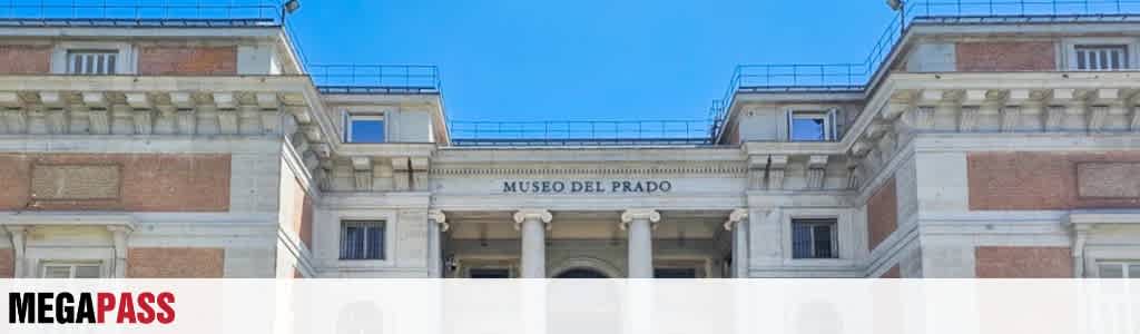 Exterior view of Museo del Prado with classical architecture and clear blue sky