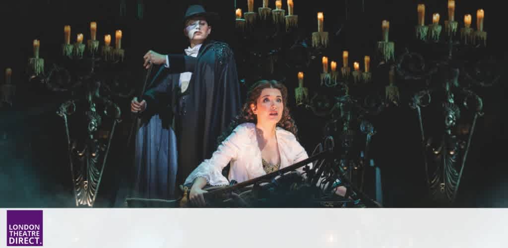 Two performers on stage with candles and dramatic lighting in a theatrical production at London Theatre Direct.