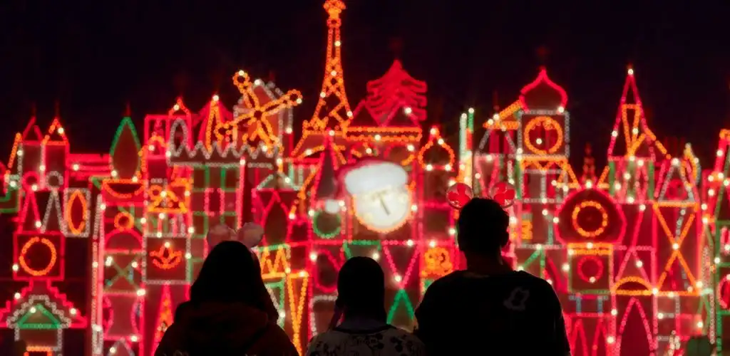 Colorful decoration and a large skeleton figure with a flower dress at a festive event at Plaza de la Flores for the Day of the Dead celebration.