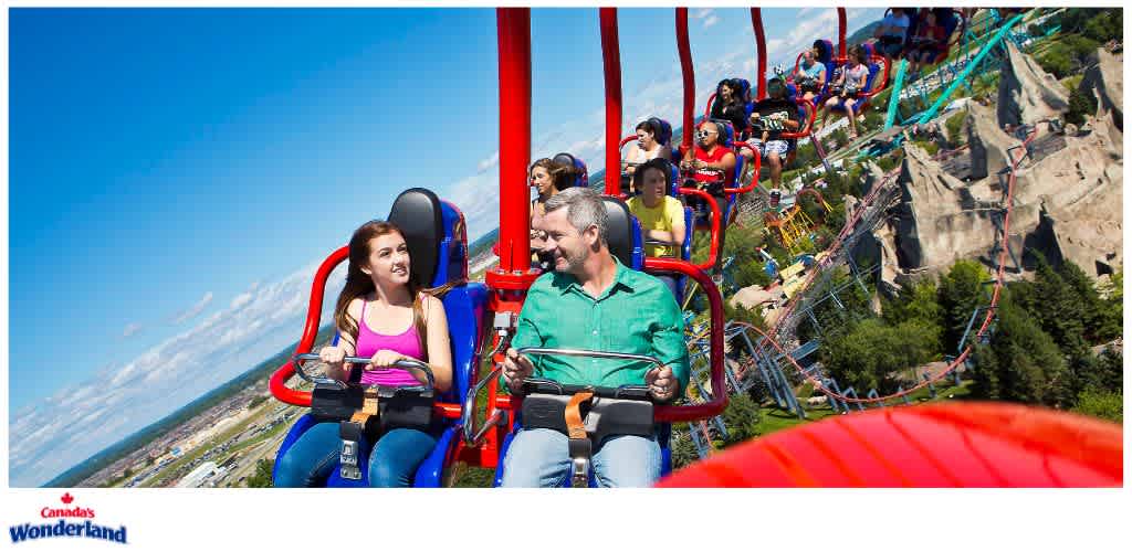 People riding on a roller coaster at Canada's Wonderland amusement park during daytime