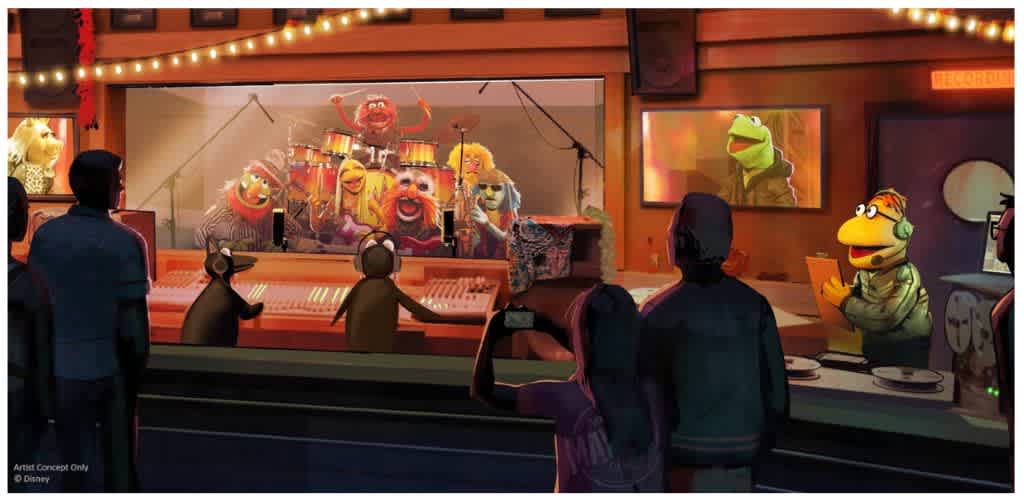 People watching a puppet show featuring Sesame Street characters in recording studio with audience and musicians in a lively setting