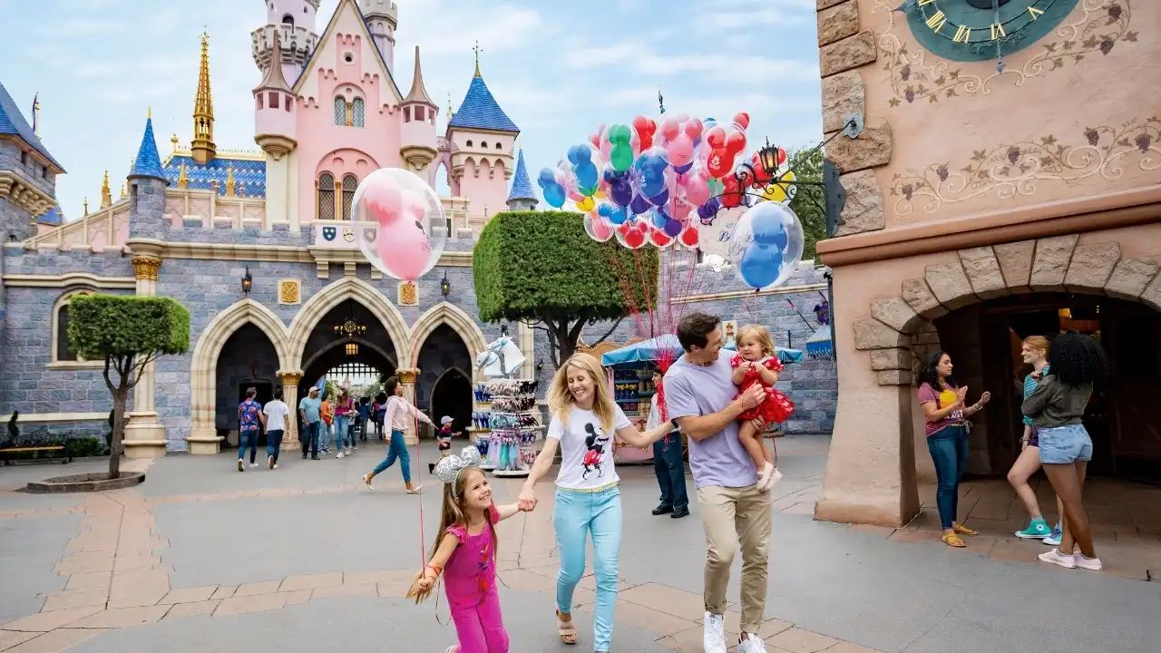 Friends laughing with Minnie Mouse at Sleeping Beauty Castle Disneyland