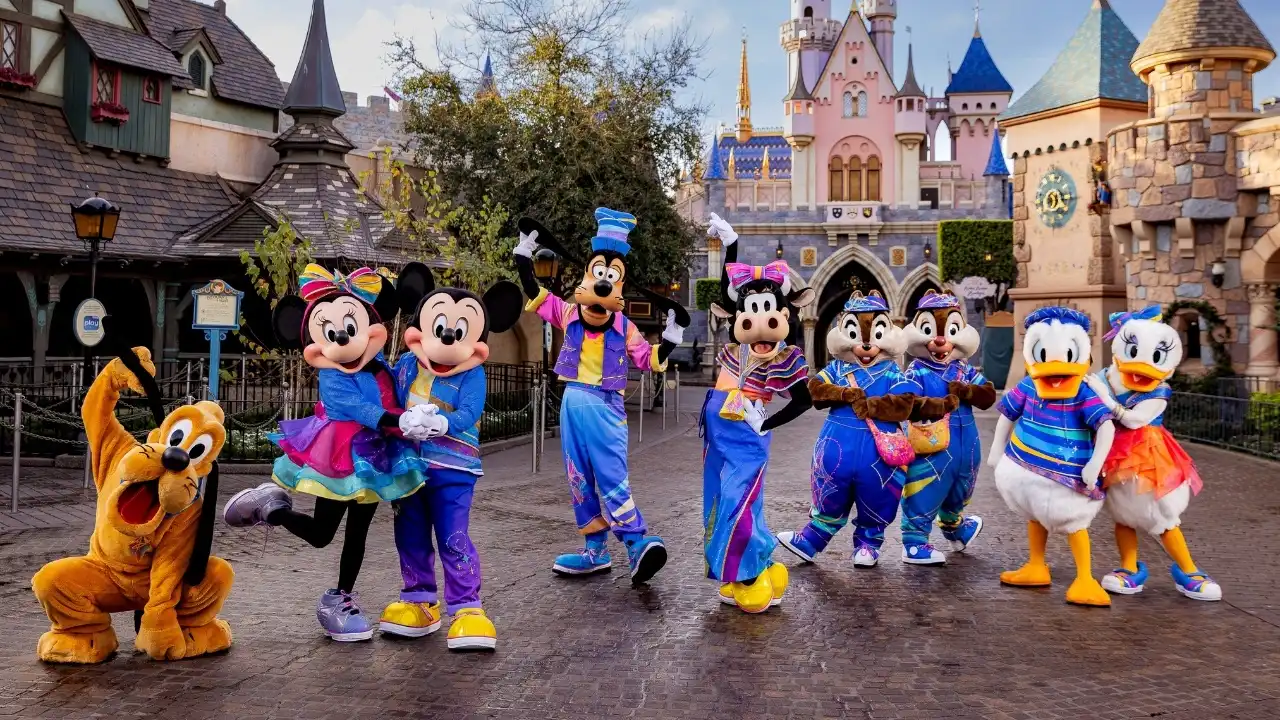 Mickey Mouse in 70th anniversary outfit on stage at Disneyland celebration
