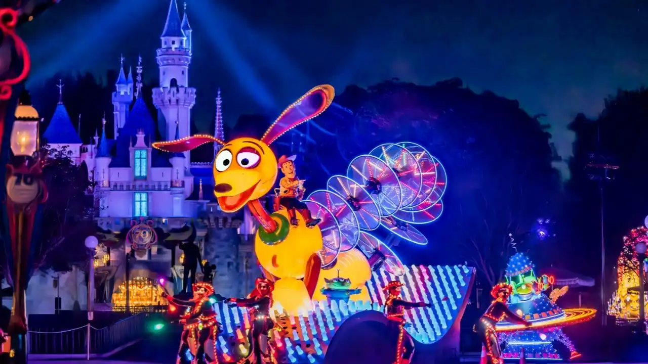 Glowing Pluto parade float at night at Disneyland Resort