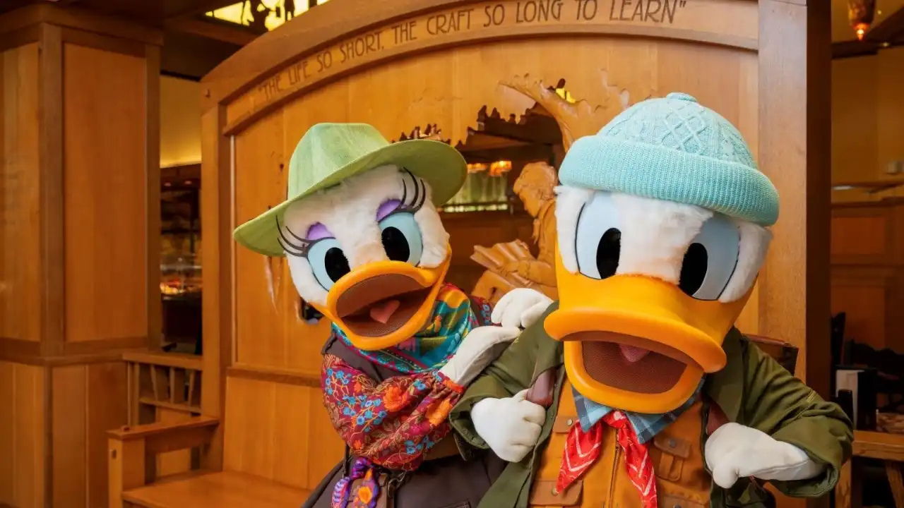 Donald and Daisy Duck in cozy outfits at a Disneyland hotel