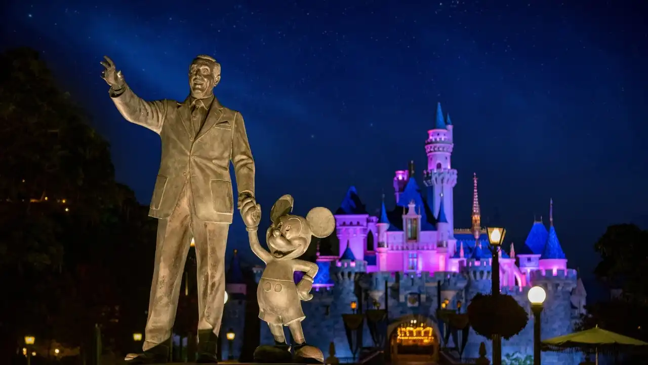 Mickey and Minnie Mouse in sparkly 70th anniversary outfits at Disneyland