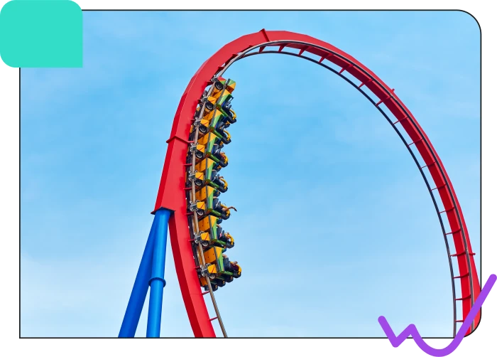 A group of riders on a roller coaster with a red track and yellow cars ascending a steep hill against a blue sky